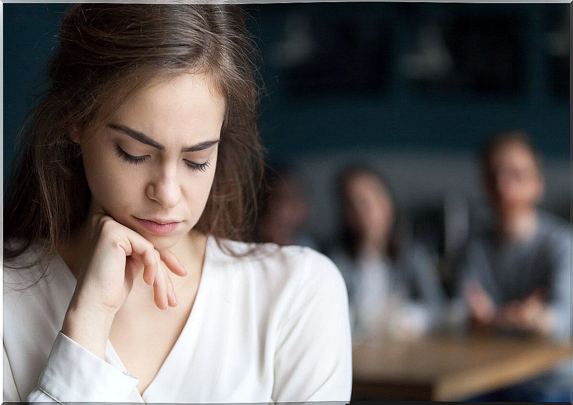 Sad woman with a lost look thinking about the things that low self-esteem robs you