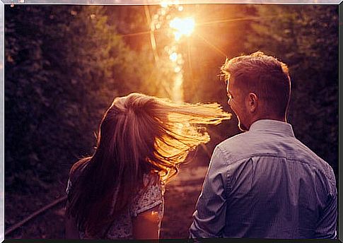 Couple spending time strolling at sunset