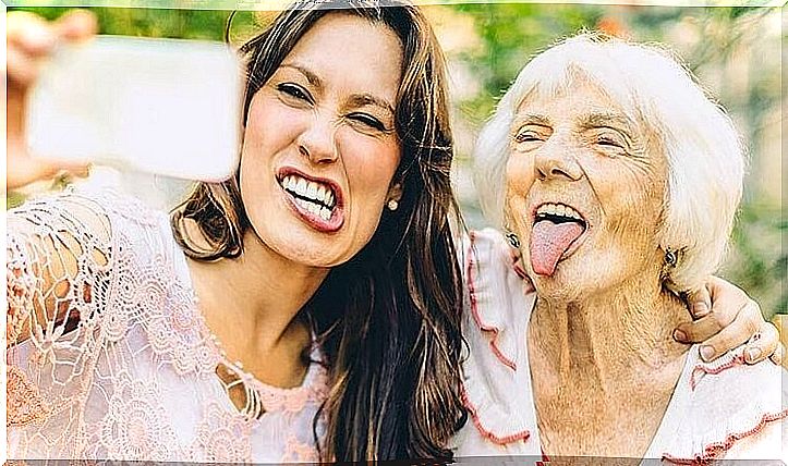 older woman with young friend thinking about growing old happy