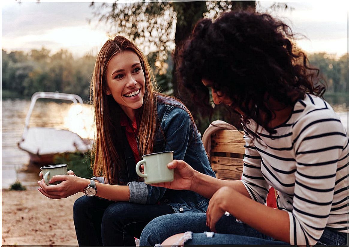 Girlfriends talking outdoors