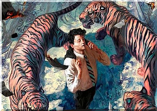 man surrounded by tigers