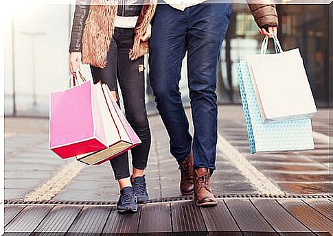 Happy Shopping Couple Representing Types Of Consumers