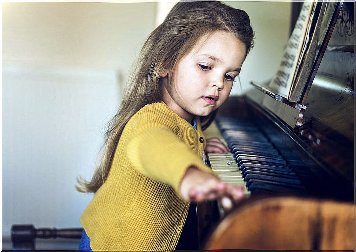 Girl playing the piano representing the relationship between ADHD and giftedness