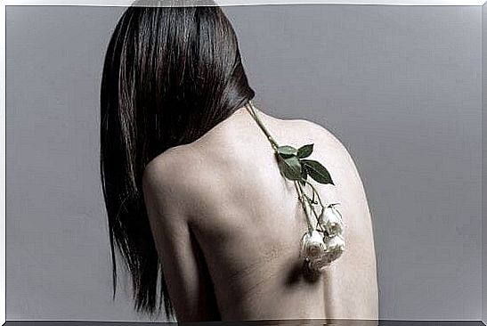 Woman with a flower on her back