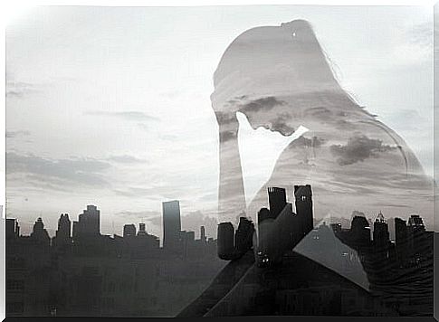 Shadow of a woman with the city in the background