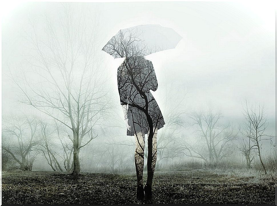 Sad woman with umbrella