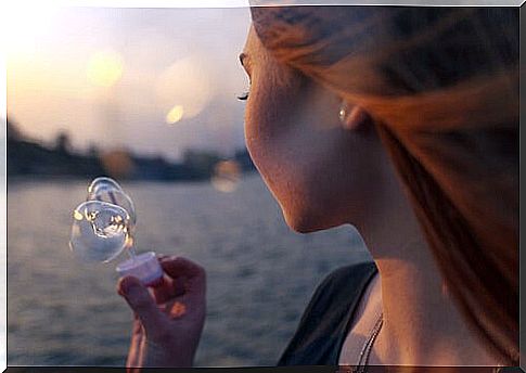 Woman blowing bubbles