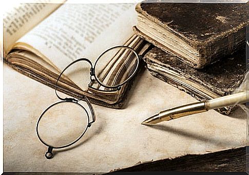 Glasses on old book