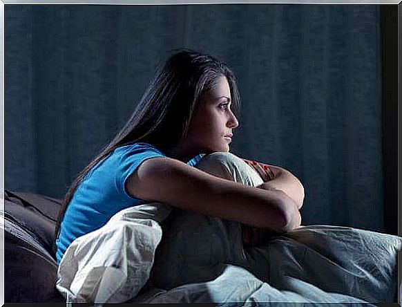 Woman awakened by insomnia