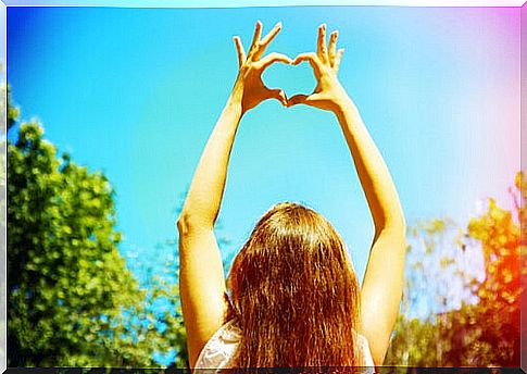 Woman forming a heart