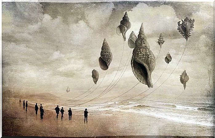 men with kites in the shape of seashells