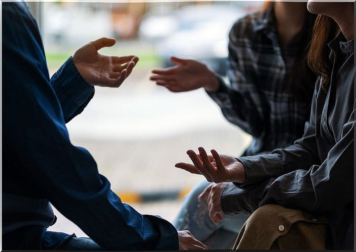 People talking by waving their hands