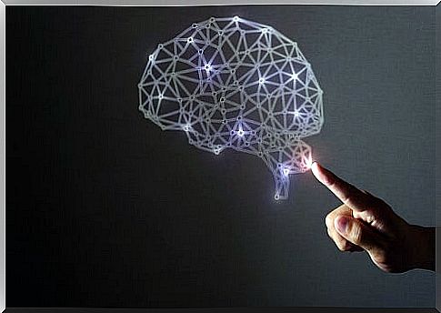 Hand pointing to a brain with lights representing the science of neurhappiness