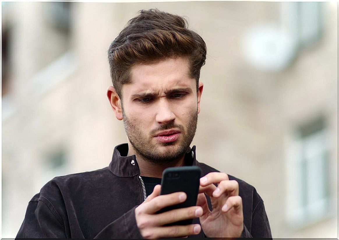 Man reading mobile messages about Sadfishing