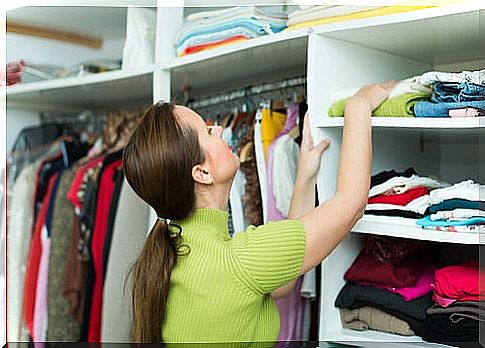 Woman tidying closet