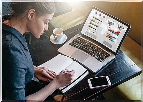 Motivated woman working on her computer