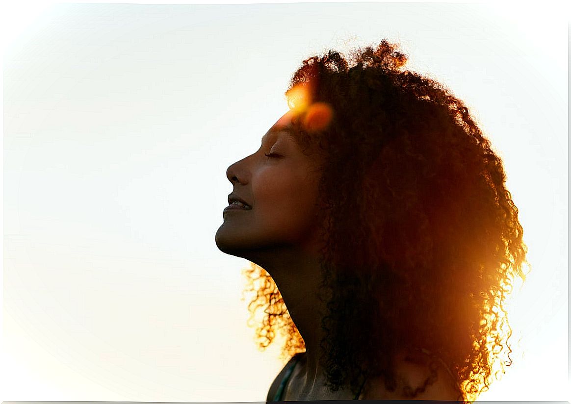 Woman with eyes closed meditating