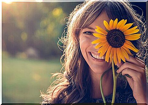 Woman with a flower representing simplicity