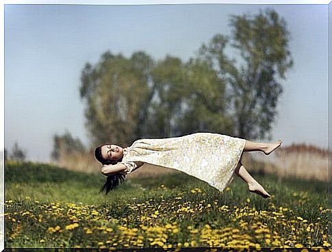 Levitating girl in the field